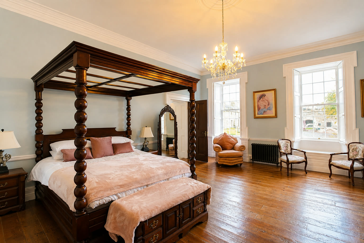 A guest bedroom with a four-poster bed